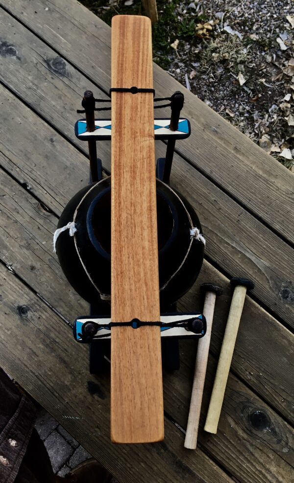 A Limba/Mbila - Ilimba Drum is sitting on a wooden table.