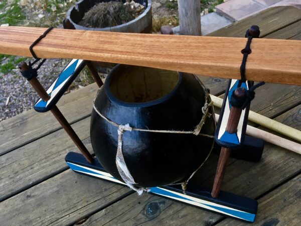 A Limba/Mbila - Ilimba Drum is sitting on a wooden table.