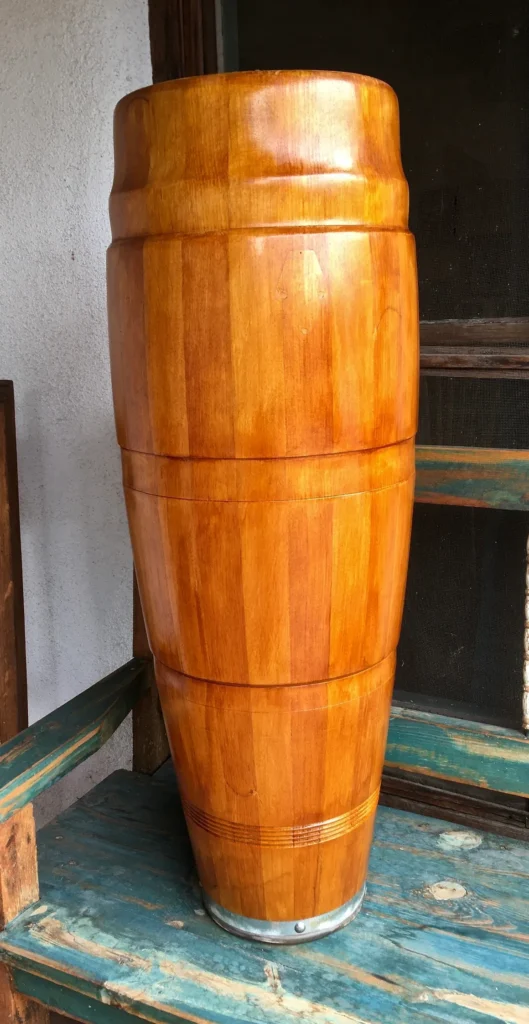 A Kongoma barrel sitting on top of a bench.