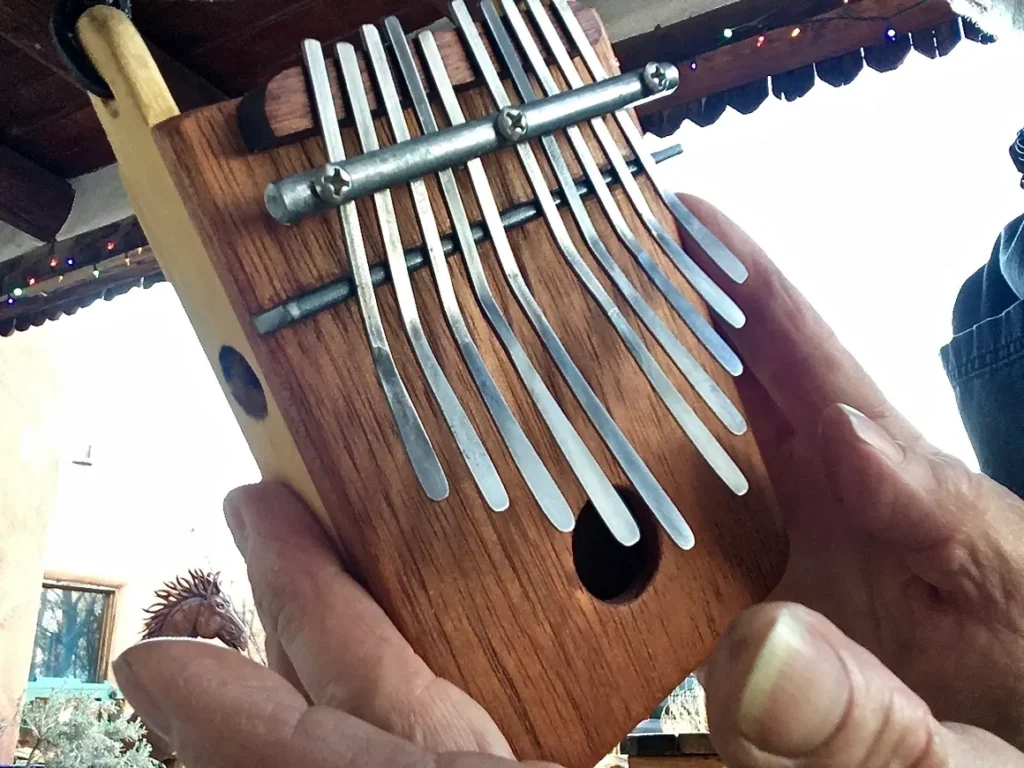 A person playing an African xylophone, also known as a Ngoma.