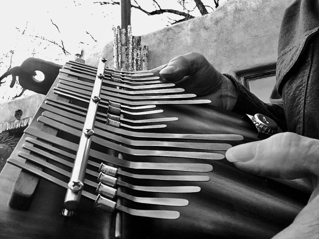 A person playing a Lamellaphone instrument.