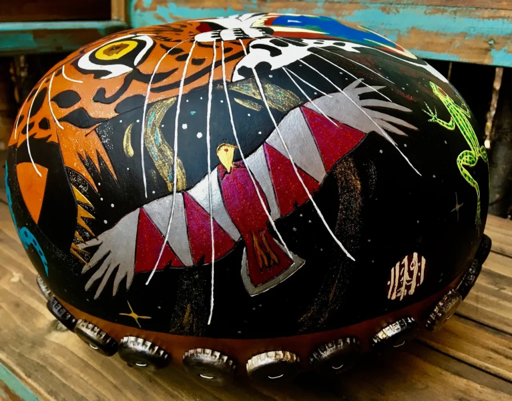 A motorcycle helmet adorned with a fierce tiger illustration.