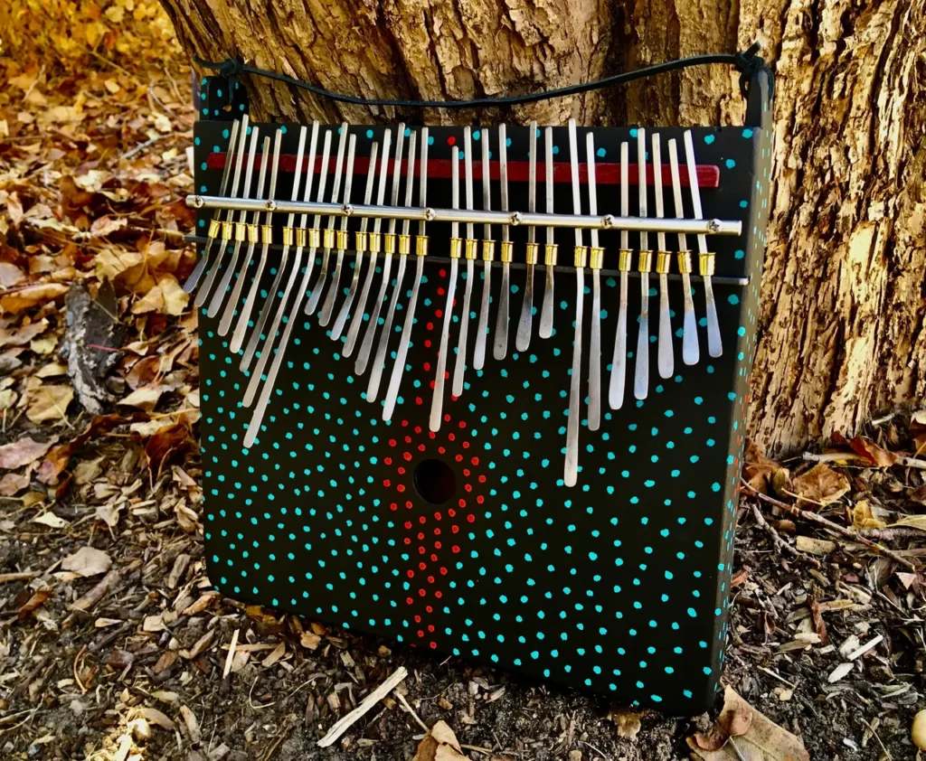 A bag adorned with an abundance of sticks, featuring intricate patterns inspired by Kongoma and Marimbula.