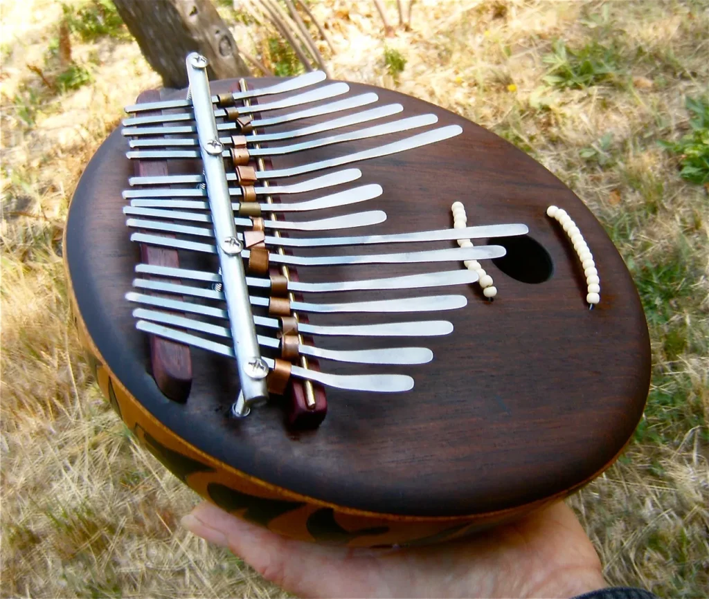 A person is playing a ngoma, a wooden musical instrument popular in African music.