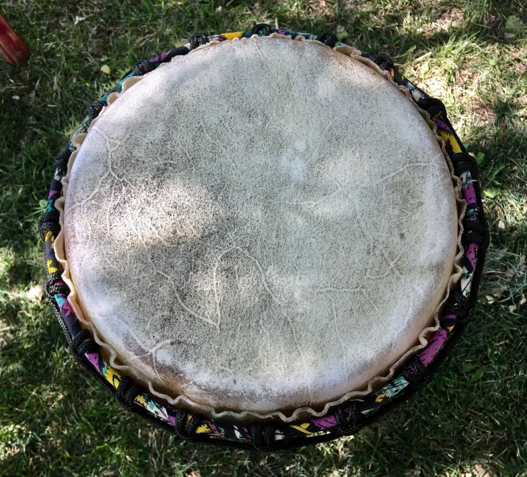 An Ilimba drum sitting on the grass.