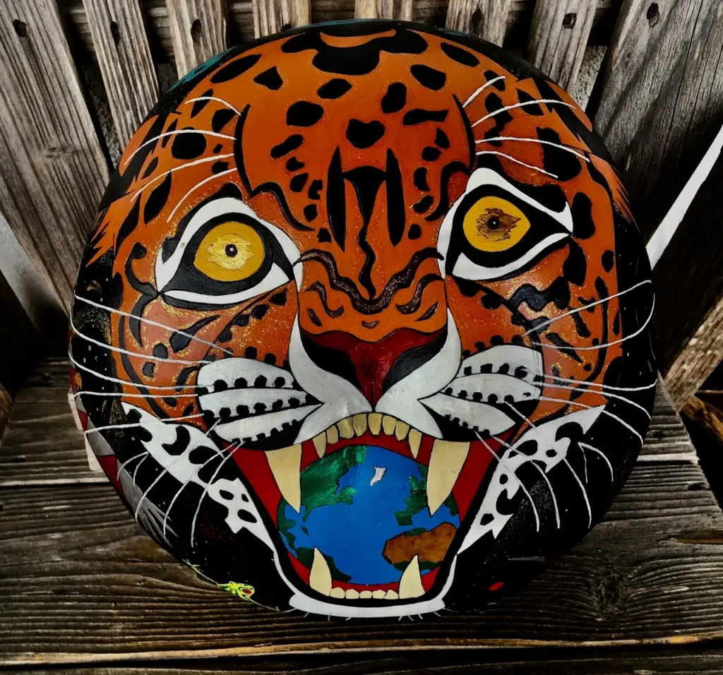 A motorcycle helmet with a tiger on it, inspired by African harps.