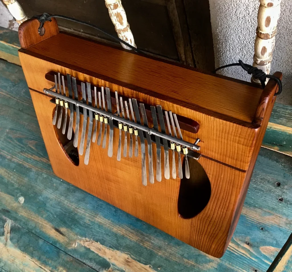 A lamellaphone sitting on top of a wooden table.