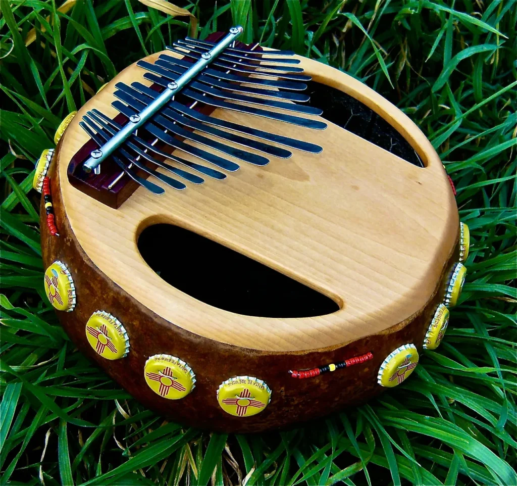 An Ilimba, an African harp, placed on the grass.