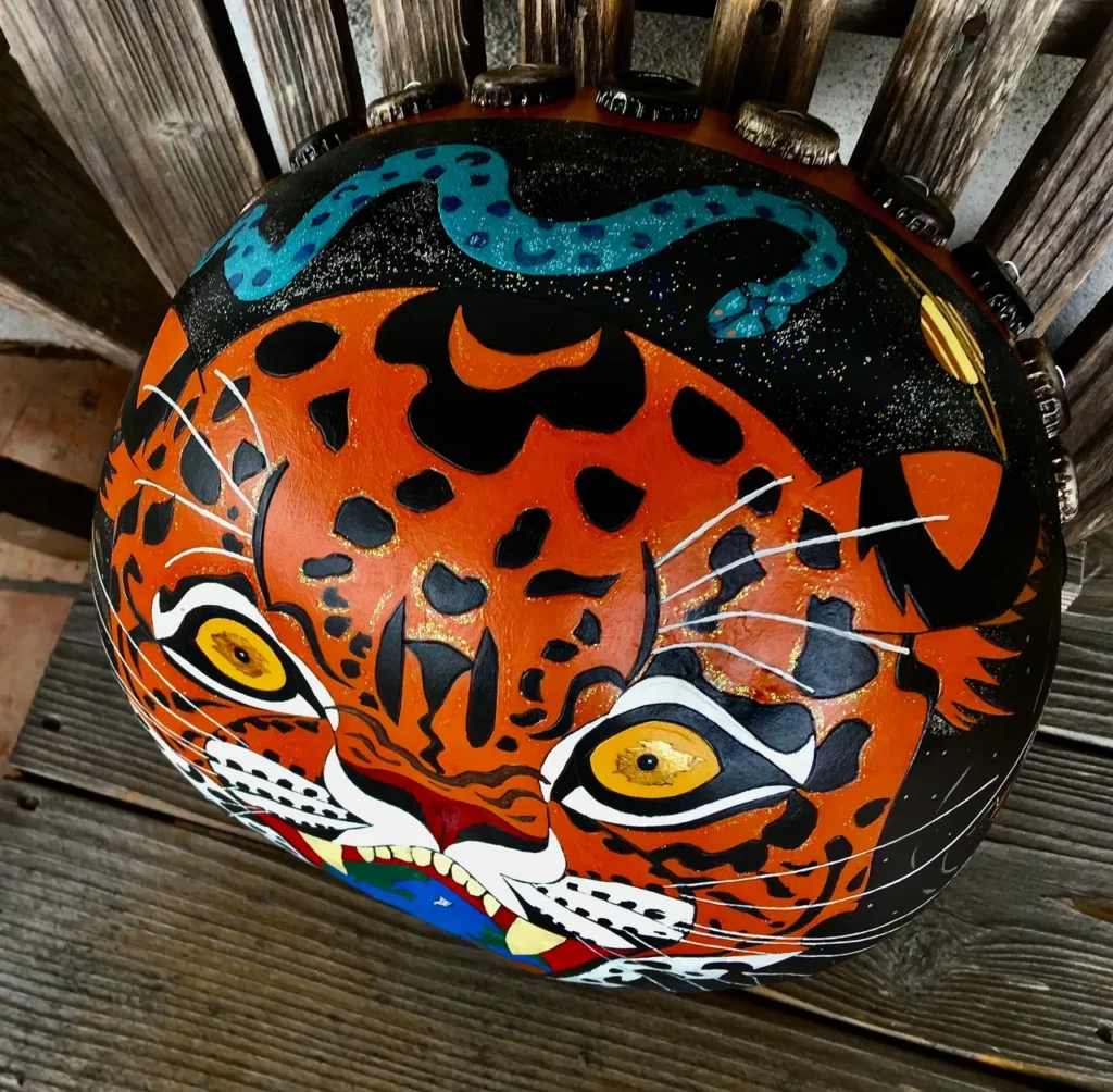 A jaguar painted on a wooden chair made from African Ilimba wood.