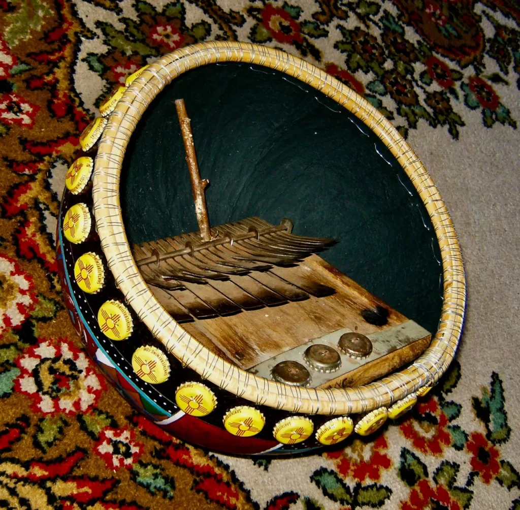 A Ngoma, an African musical instrument, resting on a rug.