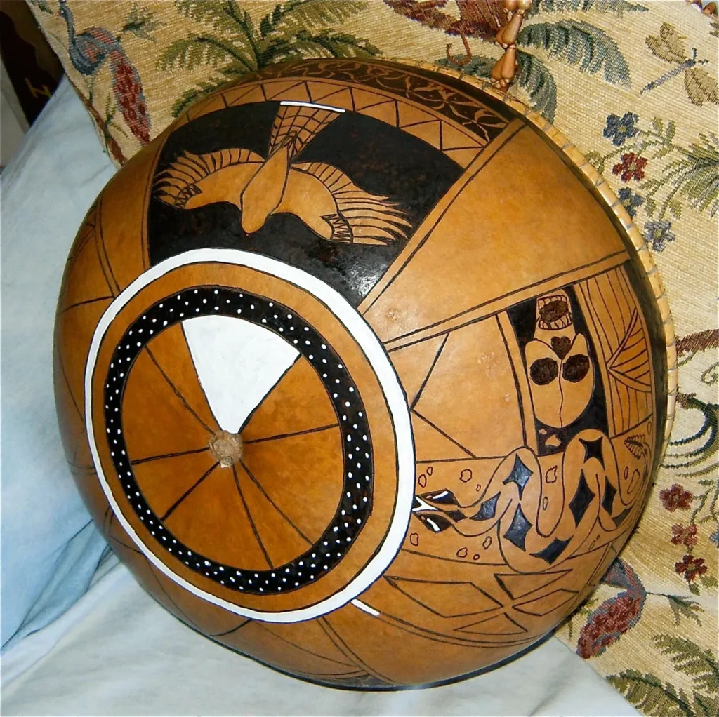 An African Music Ngoma drum, adorned with intricate brown and black designs.