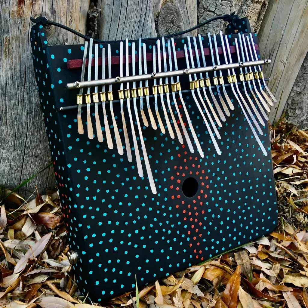 A bag adorned with an abundance of sticks, including Kongoma and Marimbula.