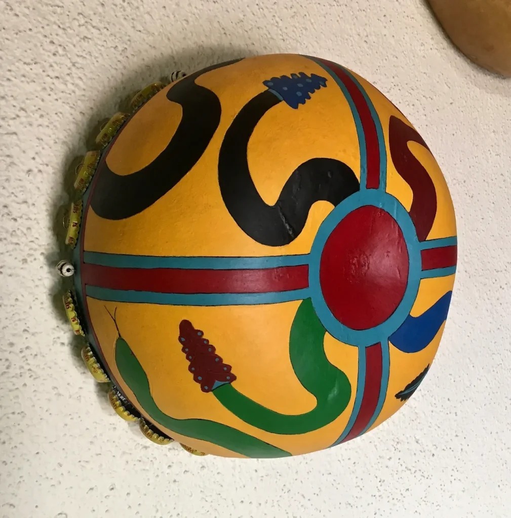 An African Music ngoma drum hanging on a wall.