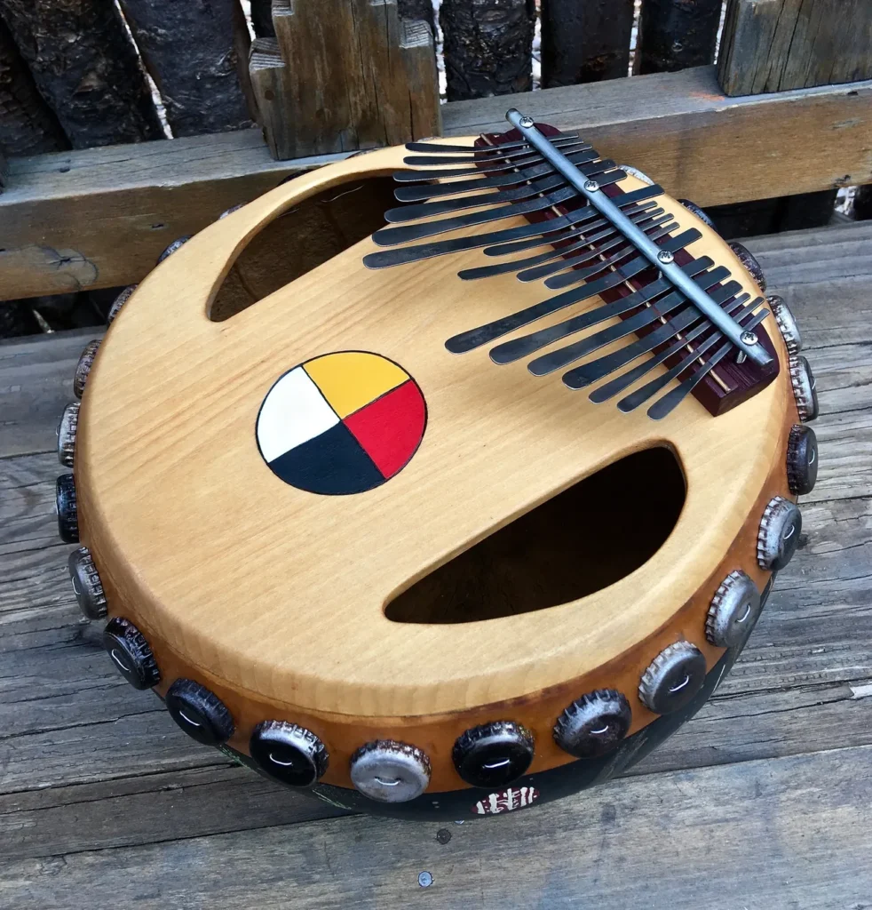 A wooden instrument with an Ilimba symbol on it.