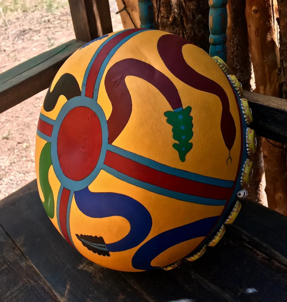 A vibrant Ngoma drum sitting on a rustic wooden bench, embodying the rich heritage of African music.