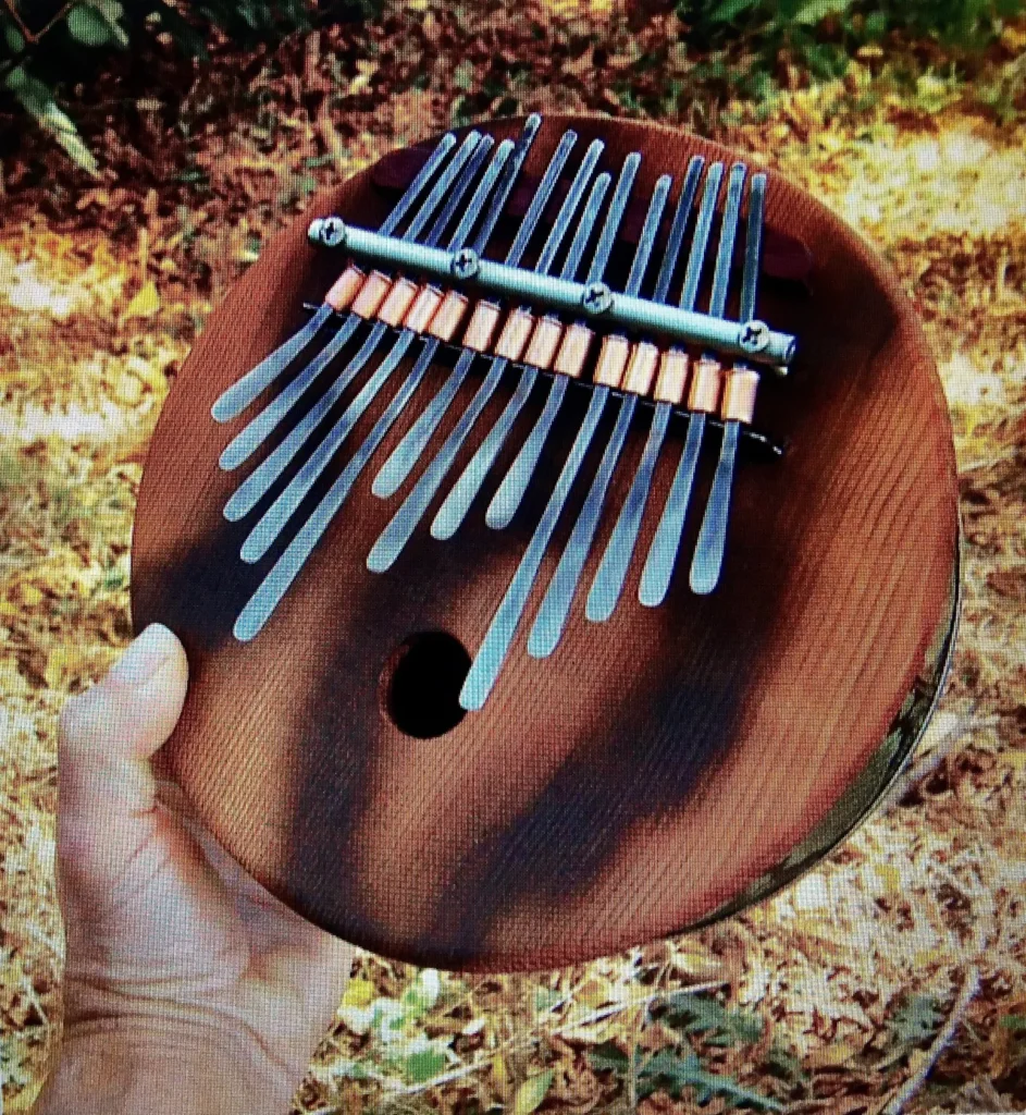 A person playing a wooden ukulele while surrounded by the serene beauty of the woods.