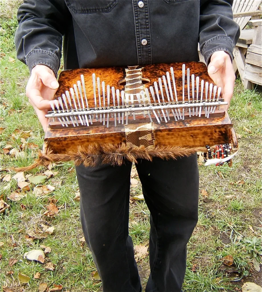 A man is holding a wooden box filled with nails.