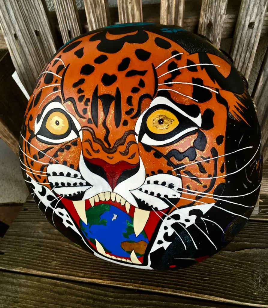 A tiger painted on a wooden bench inspired by African harps.