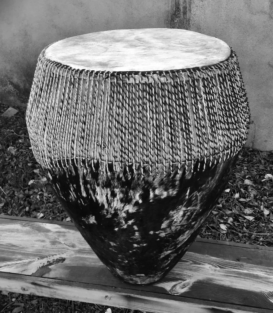 A black and white photo of a djembe.