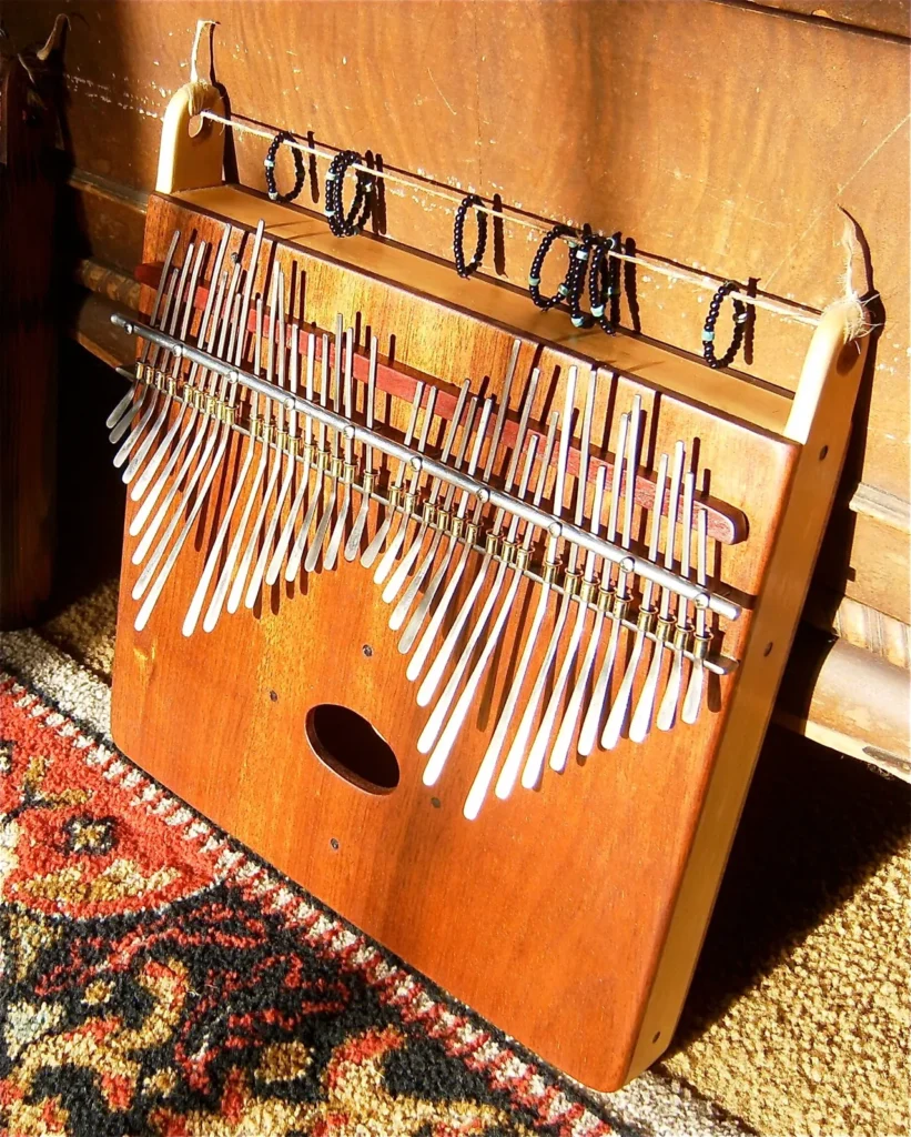 A wooden xylophone sitting on a rug.