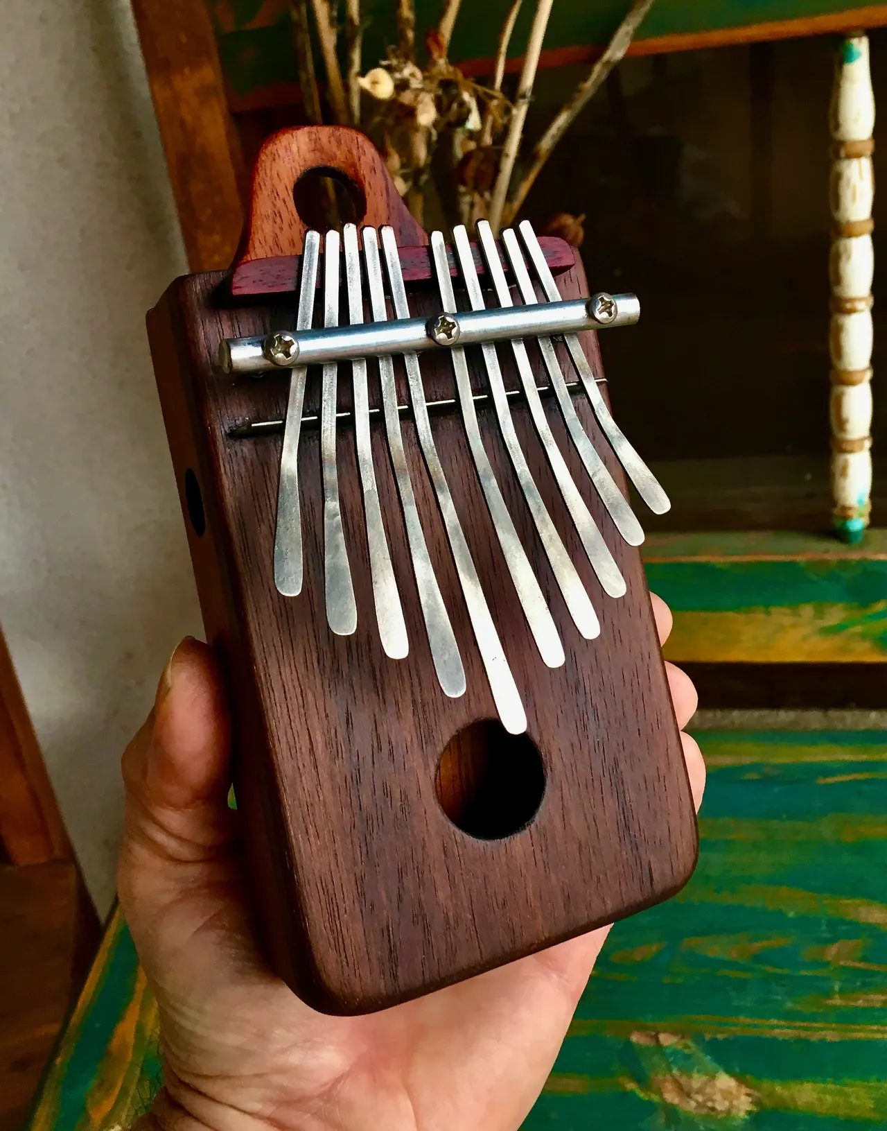 A person is playing an African xylophone known as a Ngoma, producing captivating traditional melodies.