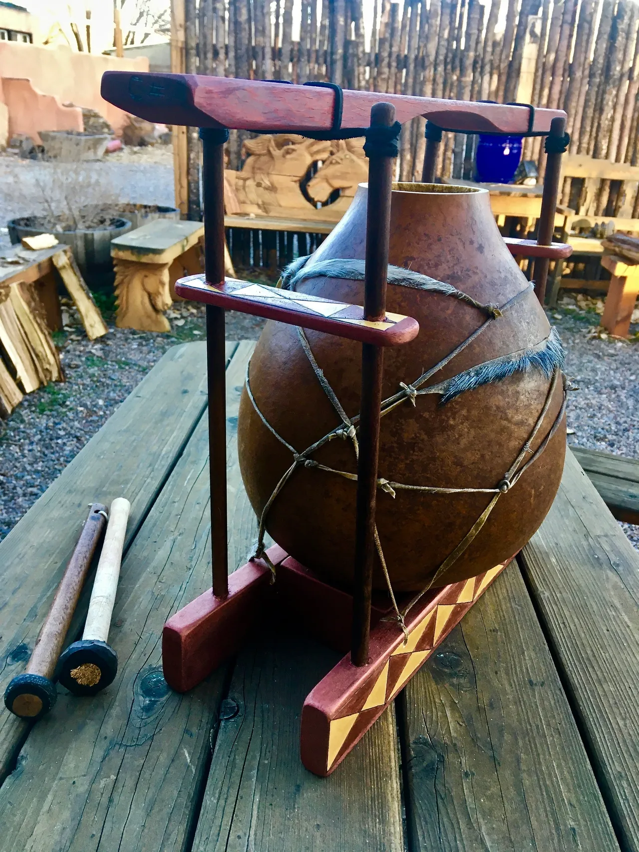 A gourd lamellaphone is sitting on a wooden table.