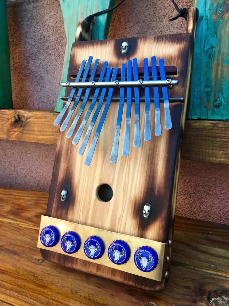 A wooden ukulele is placed on top of a sturdy table.