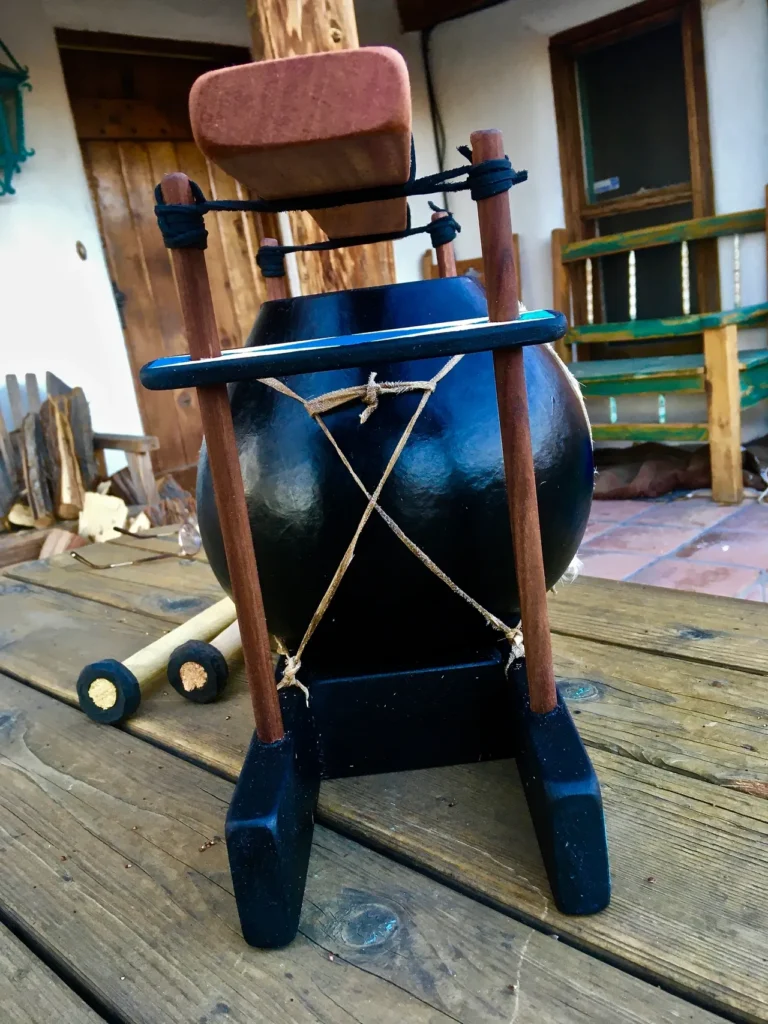 A lamellaphone drum sitting on top of a wooden table.