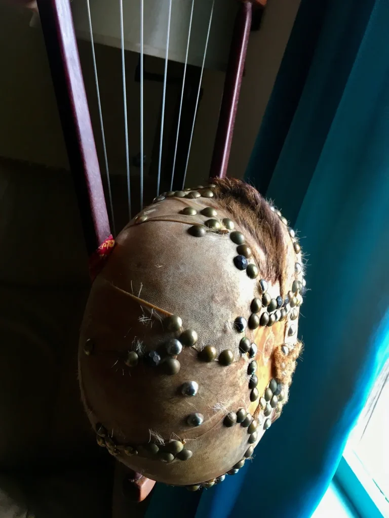 An African drum with a ball on it.