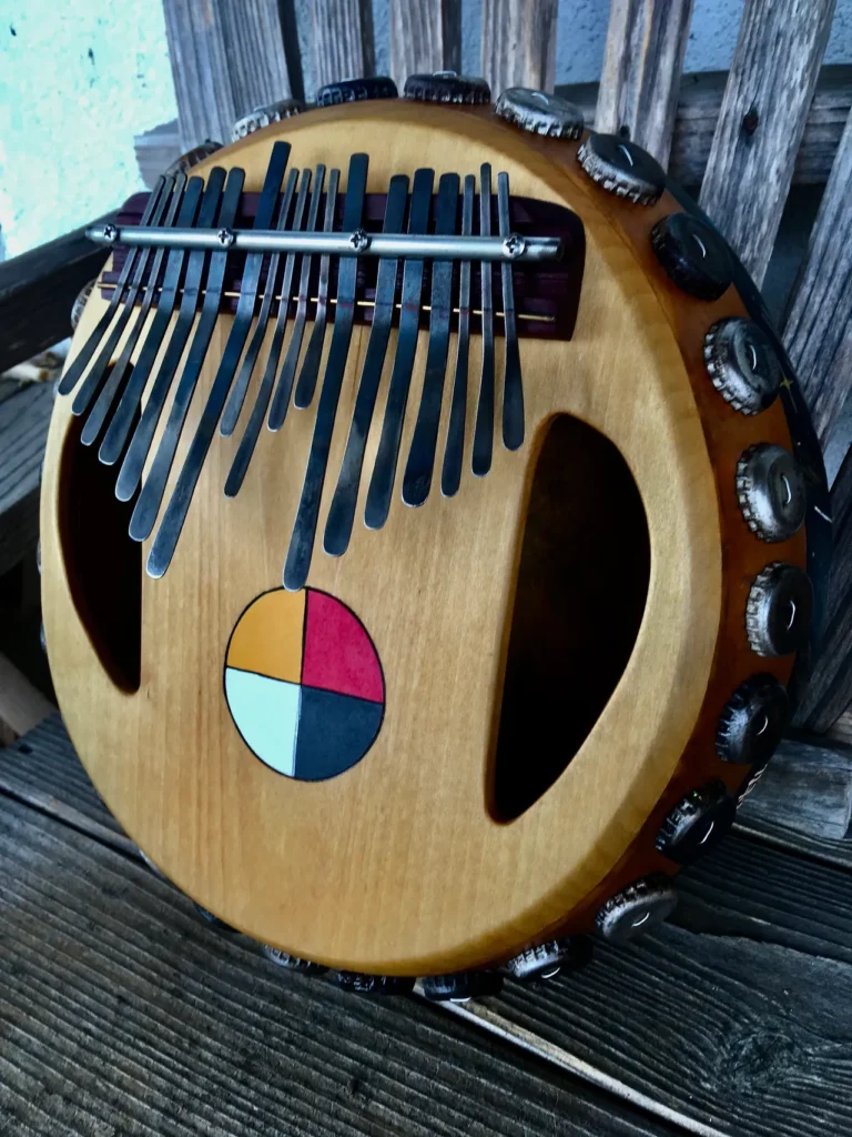 An Ilimba ukulele with a red, white, and blue design.