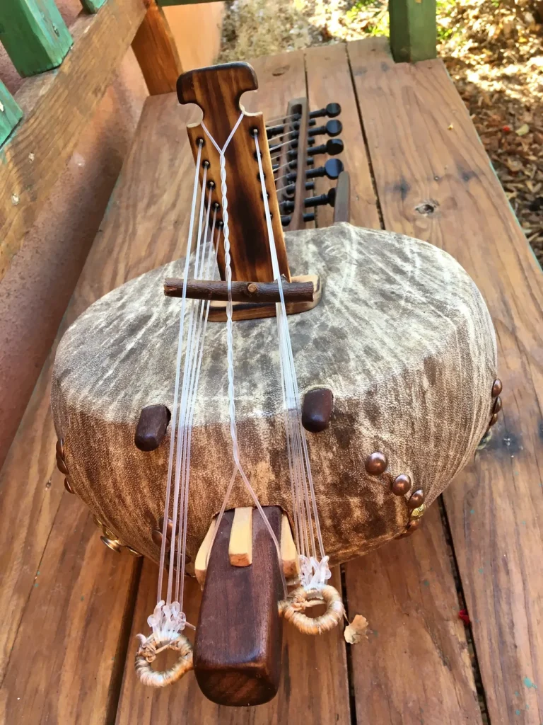 An Ngoma instrument is sitting on a wooden table.