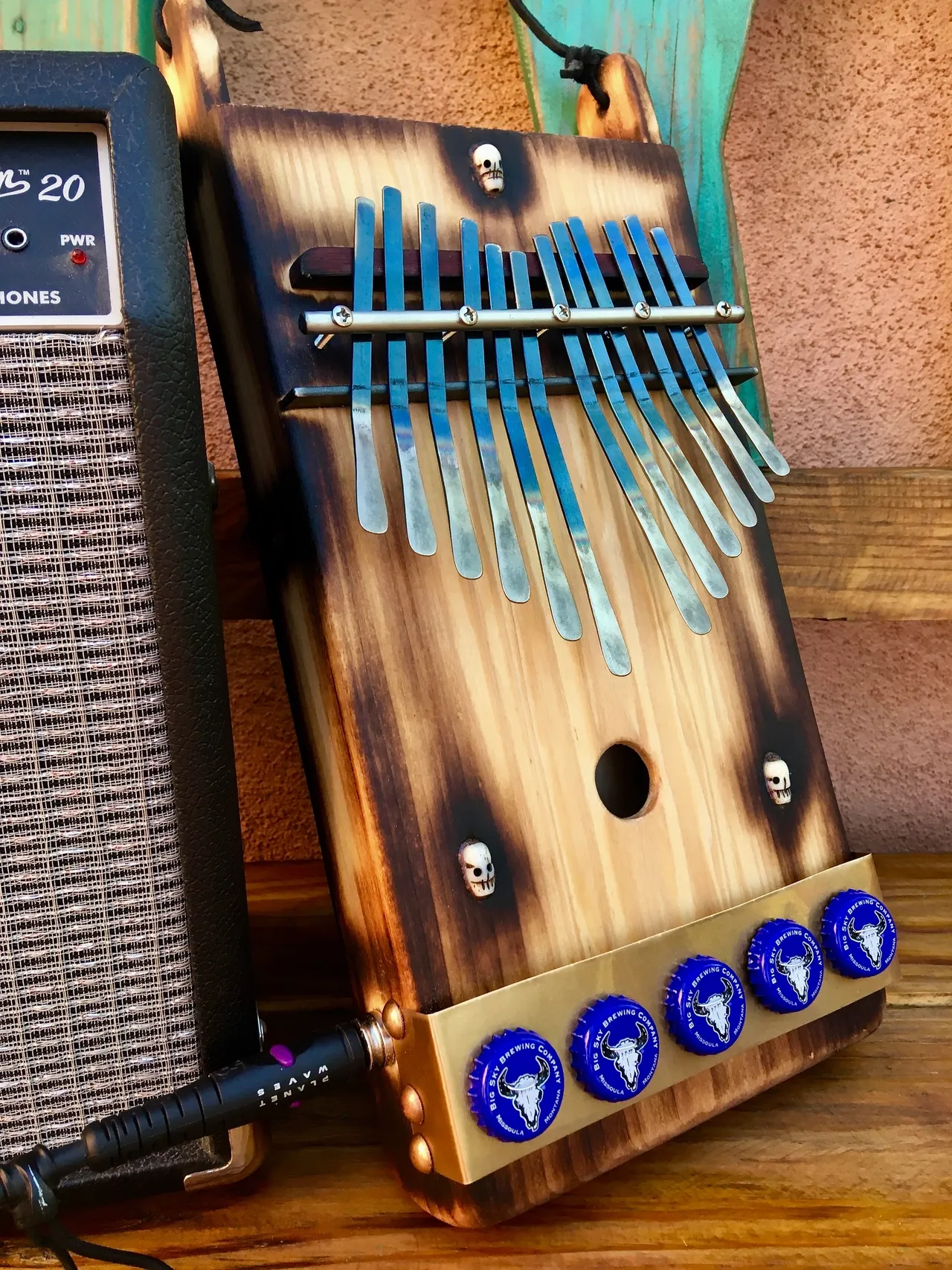 A wooden xylophone, a lamellaphone, sitting on a wooden table.