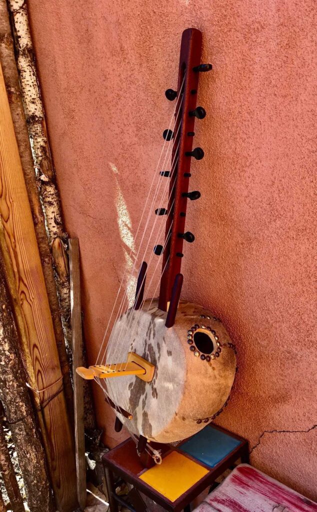 An Ngoma, a wooden instrument with deep cultural roots in African music, sitting on top of a wall.