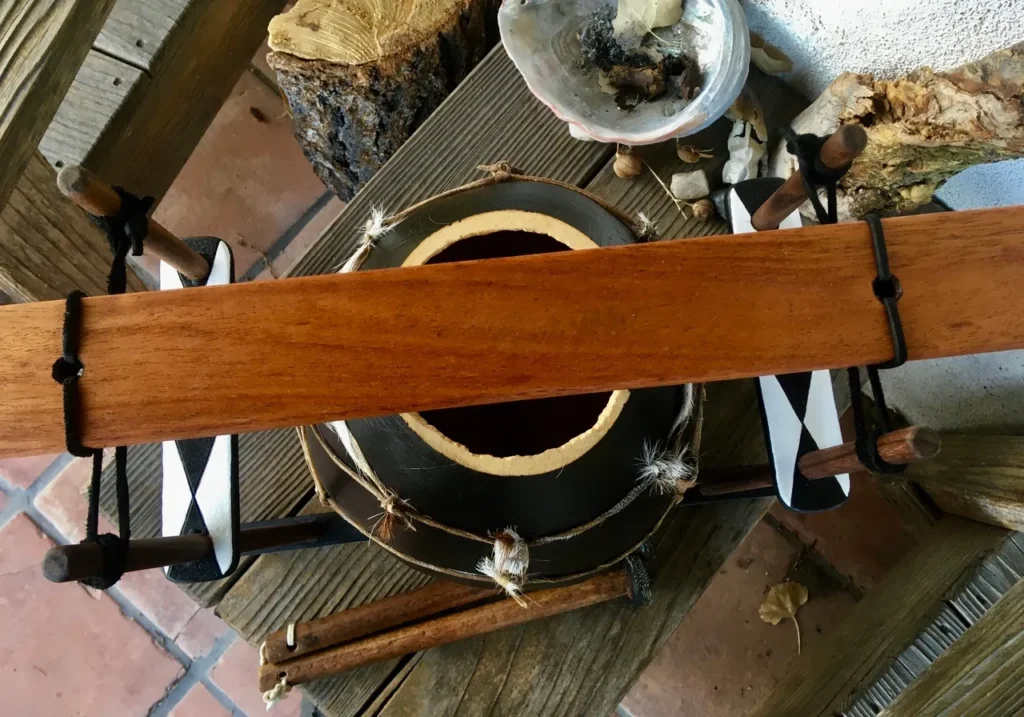 A wooden Lamellaphone is sitting on top of a wooden table.