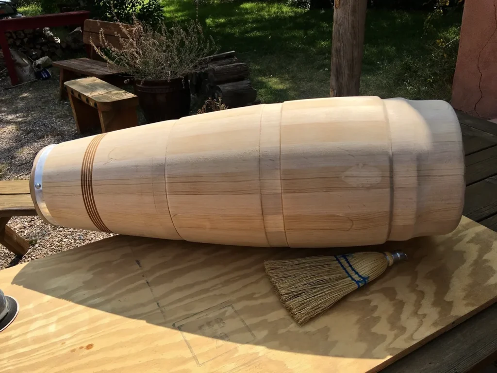 An Ilimba barrel sitting on a Kongoma table.