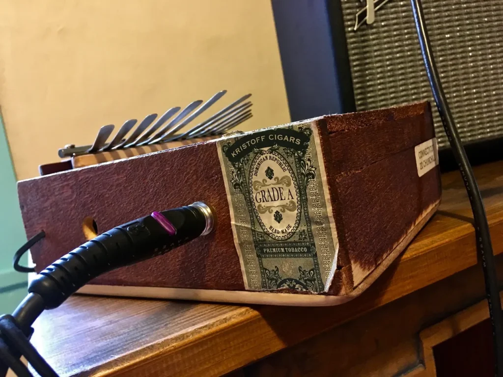 A lamellaphone sitting on top of a wooden table.