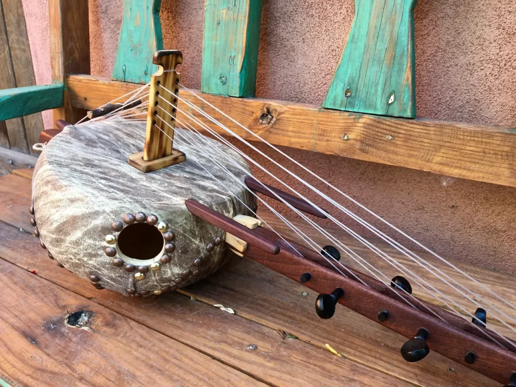 A Ngoma, an African wooden instrument, sitting on a wooden bench.