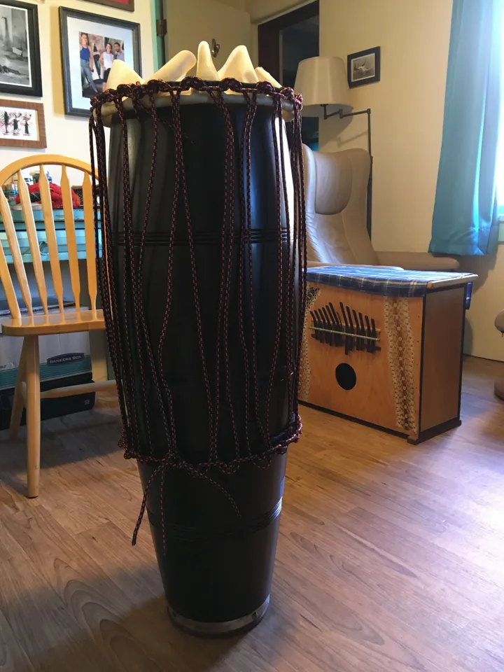 An Ilimba on a wooden floor in a living room.