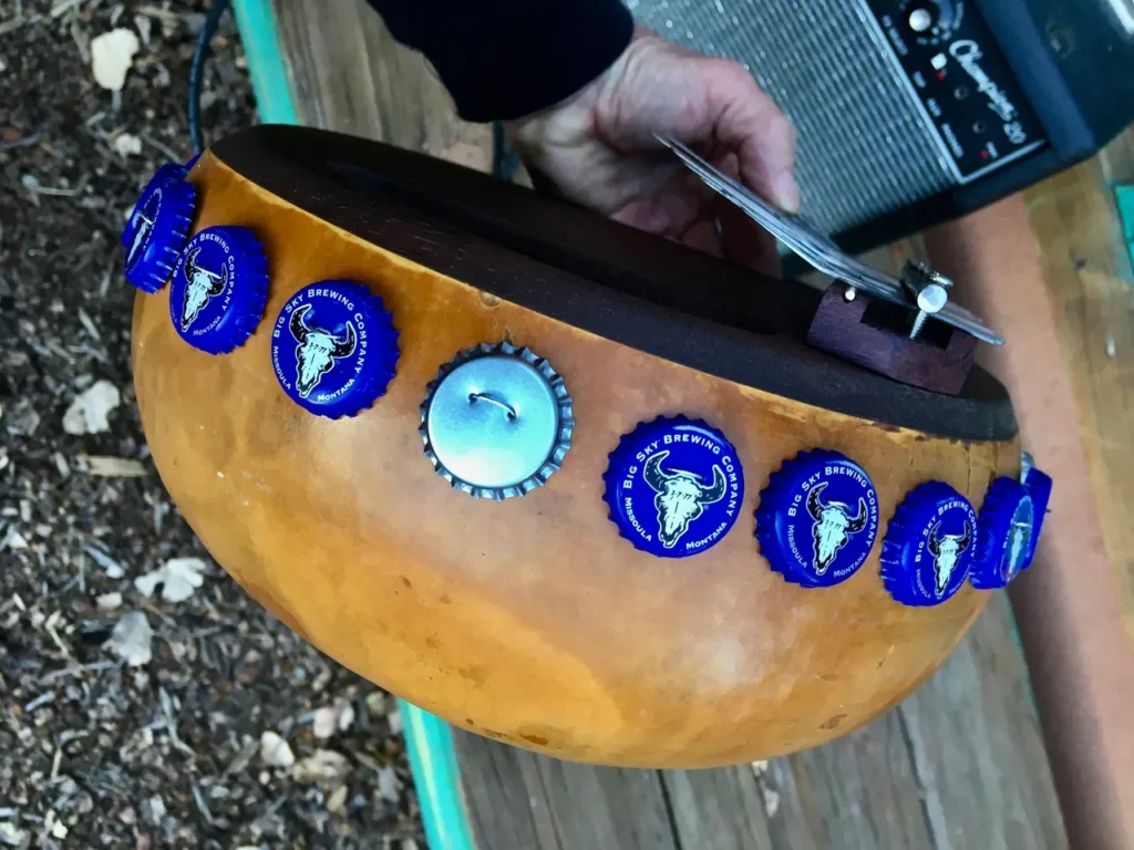 A person is holding an Ilimba drum.