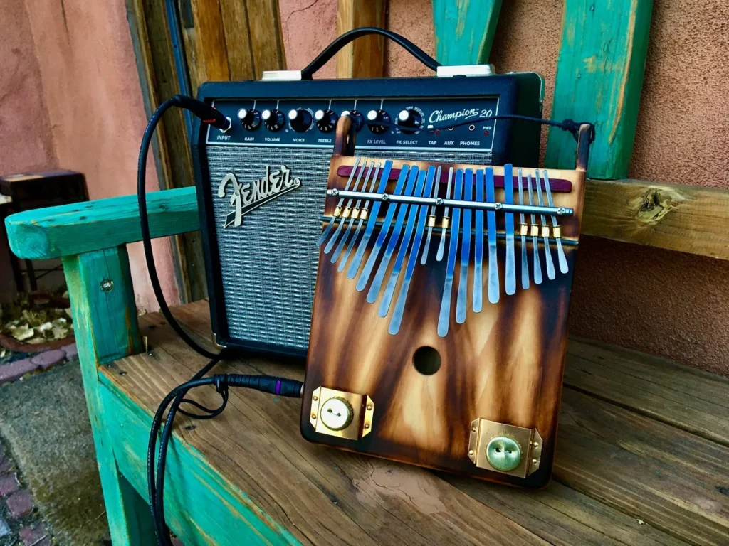 A wooden Lamellaphone instrument sits on top of a wooden bench.