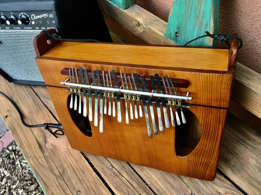 A wooden xylophone, also known as a lamellaphone, sitting on a wooden table.