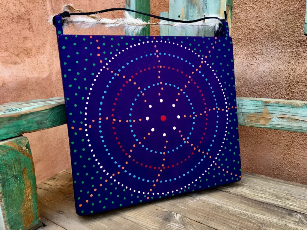 A bag with a blue and red Kongoma design on it.