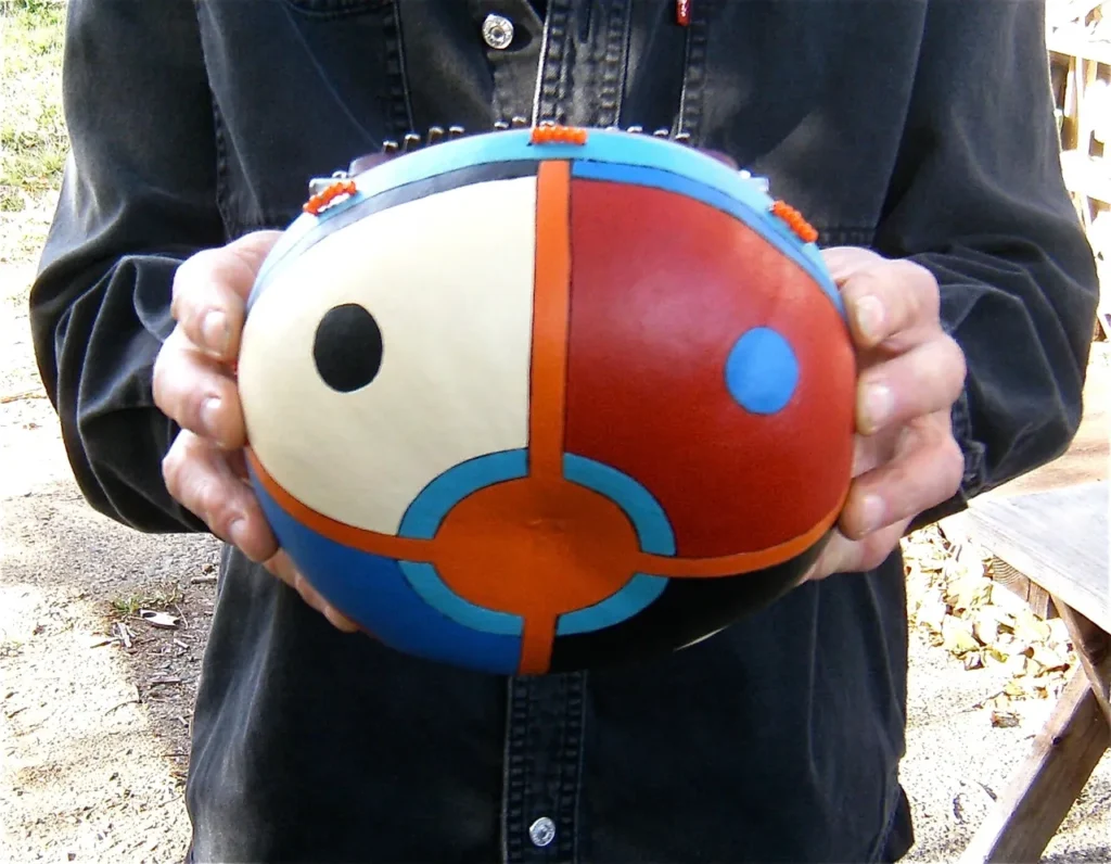 A Ngoma performer holding a colorful ball.